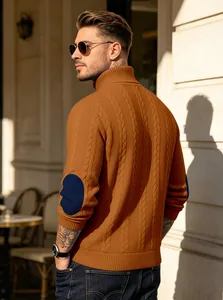 Detailed back view of men's brown cable knit sweater with blue elbow patches.