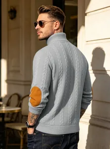Men's stylish grey cable-knit turtleneck sweater with brown faux leather elbow patches.