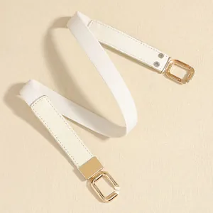 Close-up detail of white elastic waist belt with elegant gold-tone metal buckle