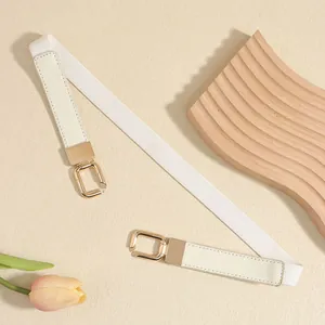 Detailed view of a white elastic skinny belt featuring elegant gold interlinking buckles