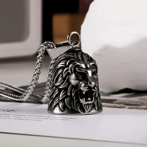 Close-up view of a vintage stainless steel lion head bell pendant biker necklace