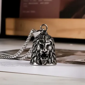 Detailed macro view of the vintage stainless steel lion head bell pendant necklace