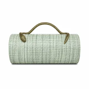 Woven cylinder evening bag detail with a vintage gold metal snake shaped handle
