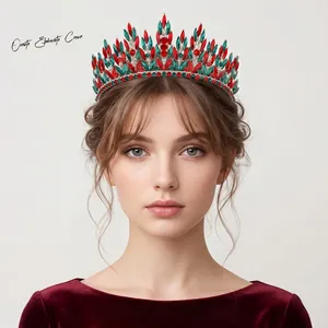 Model wearing an ornate Christmas rhinestone crown with red and green stones