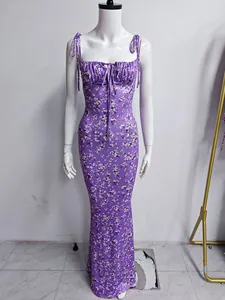 Purple floral maxi dress with ruched bust and spaghetti straps for summer vacations.