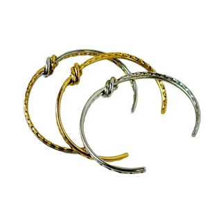 Fashionable twisted knot stainless steel open cuff bracelets in gold and silver finish