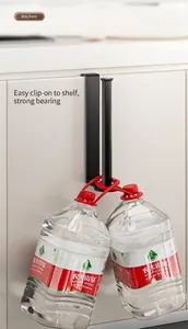 Detail of black under cabinet paper towel holder showing high load bearing capacity