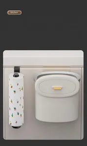Detail showing no-drill paper towel holder and wall-mounted storage bin on cabinet