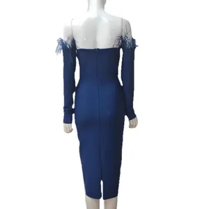 Elegant navy blue off-shoulder bandage dress featuring feather trim and long sleeves