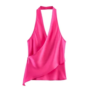Vibrant pink satin halter top with wrap front and elegant draped design.