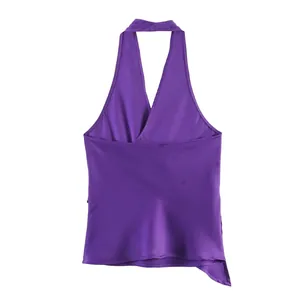 Close-up detail of a purple satin halter neck top showing smooth fabric texture