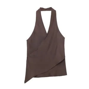 Close-up of brown satin halter neck top with elegant wrap design and silk texture
