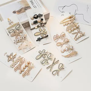 Elegant set of pearl and rhinestone hair clips with diverse vintage floral designs