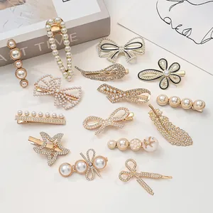 Detailed close-up of gold hair clips with elegant pearls and sparkling rhinestones