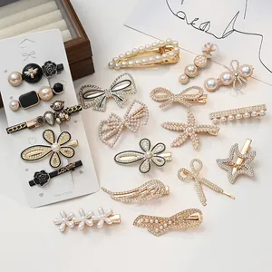 Elegant pearl and rhinestone hair clip set featuring bear, feather, and scissors designs.