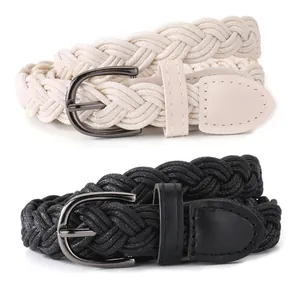 Detailed view of black and cream braided twist belts with metallic D-ring buckles.