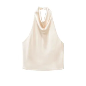 Detail view of an elegant champagne satin halter neck top with a draped neckline