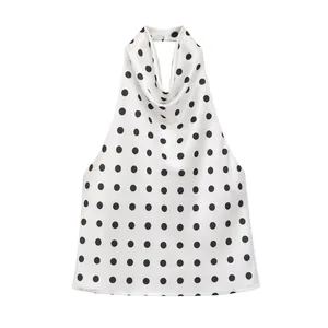 Elegant white satin halter neck top featuring classic black polka dots pattern