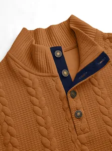 Detail view of men's brown waffle knit henley sweatshirt with buttoned stand collar