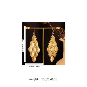 Detailed view of golden leaf tassel earrings with size and weight measurements