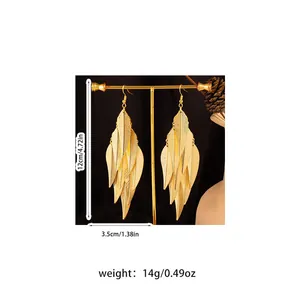 Detailed view of long gold layered leaf tassel earrings with size and weight specs