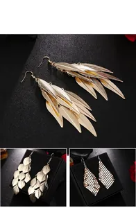 Detailed view of fashion golden leaf tassel earrings and shimmering mesh metal long dangles
