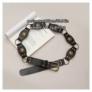 Bohemian vintage black waist belt with gold hardware and decorative studs detail