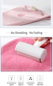 Close-up of pink coral fleece hair towel showing lint-free and colorfast features