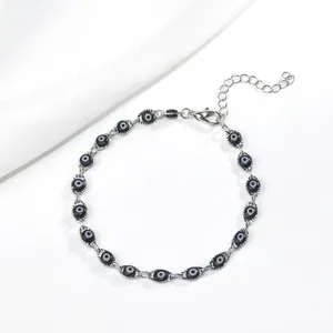 Bracelet œil maléfique en chaîne d'argent avec perles noires et fermoir mousqueton réglable