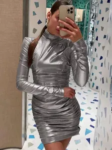 Full-length mirror selfie of a model wearing a shiny silver metallic ruched mini dress