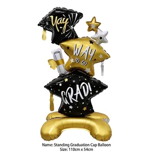 Large black and gold graduation cap foil balloon stand for graduation party decoration