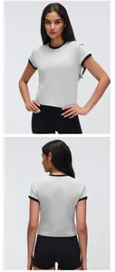 Front and back view of a grey cropped sports T-shirt with black contrast trim.