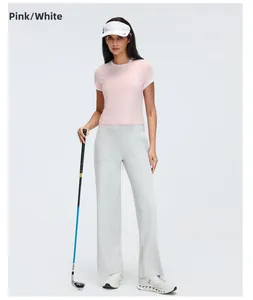Full view of women's pink sports T-shirt with white contrast trim on female model
