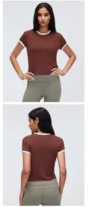 Detailed front and back views of a brown cropped sports t-shirt with white contrast trim.