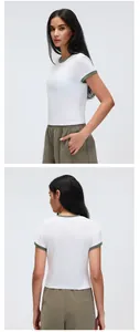 Front and back detail views of a white sport yoga t-shirt with olive green contrast trim