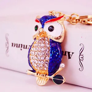Exquisite blue enamel owl keychain featuring a sparkling rhinestone-studded belly