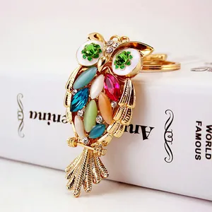 Adorable crystal-studded owl keychain with vibrant colorful gemstones in gold finish