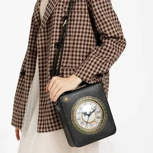 Vintage black crossbody bag with real functional clock face and embroidered sun detail