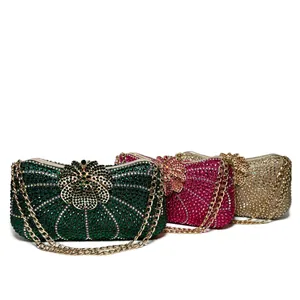 Luxury rhinestone evening clutch bags featuring flower clasps and gold chain straps