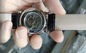 Close-up of the transparent back case and mechanical movement of a Winner automatic men's watch