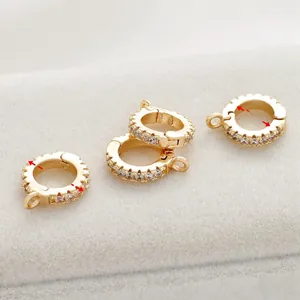 Close-up of 14K gold-plated zircon jewelry clasps with 12.5mm and 7.6mm measurements.