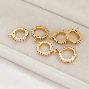 Close-up of 14K gold filled pendant clasps with zircon accents for jewelry DIY