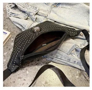 Detailed close-up view showing the interior pocket of a punk black studded waist bag with skull