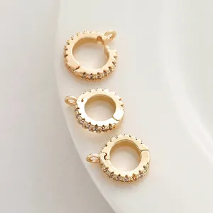 Close-up detail of 14K gold plated cubic zirconia paved jewelry clasps for DIY making