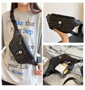 Close-up detail of punk skull waist bag showing large capacity and studded texture