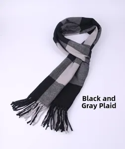 Detailed view of men's winter scarf featuring black and gray large plaid patterns