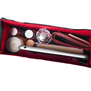 Red felt bag organizer insert with multiple compartments for cosmetics and phone.