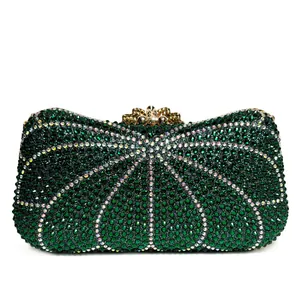 Macro view of green sparkling rhinestones on an elegant evening luxury clutch bag.