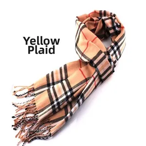 Detailed close-up view of a classic camel plaid winter scarf for men with fringe tassels