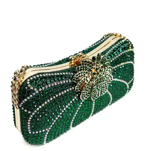 Luxury emerald green rhinestone evening clutch bag with sparkling gold flower clasp